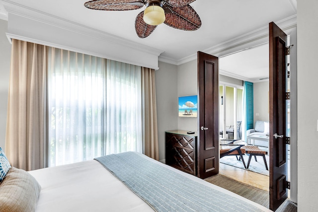 bedroom with ornamental molding, a ceiling fan, and tile patterned floors