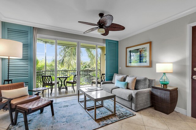 living area with ceiling fan, baseboards, tile patterned flooring, and crown molding