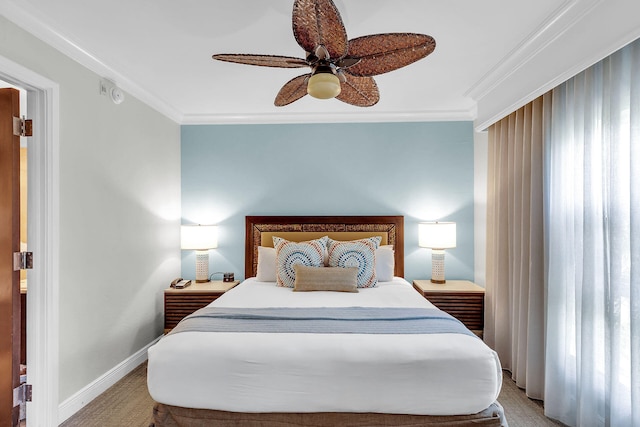 bedroom with ceiling fan, baseboards, crown molding, and light colored carpet