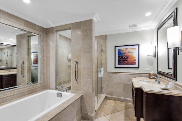 bathroom featuring a garden tub, crown molding, tile walls, and vanity