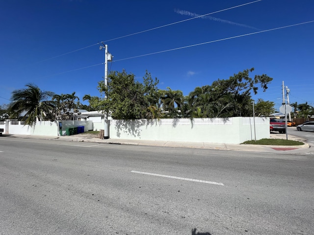 view of road with curbs and sidewalks