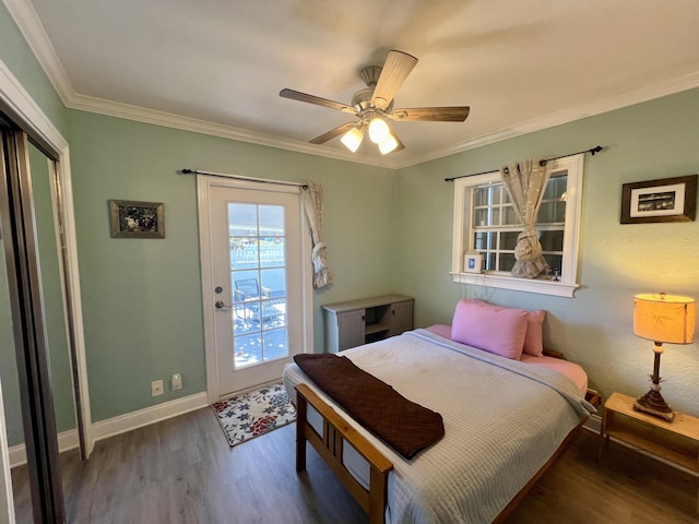 bedroom with baseboards, a ceiling fan, dark wood-style floors, ornamental molding, and access to outside