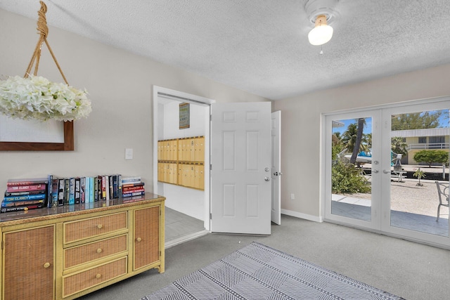 119 Cortez Dr Unit 8G, Islamorada, FL 33036 - carpeted foyer featuring a textured ceiling and baseboards