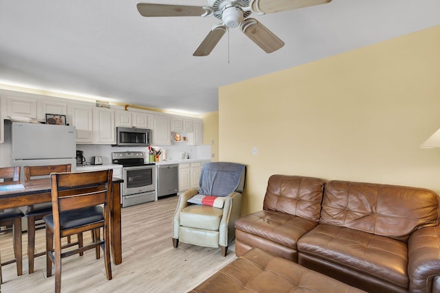 119 Cortez Dr Unit 8G, Islamorada, FL 33036 - living area featuring light wood-style flooring and ceiling fan
