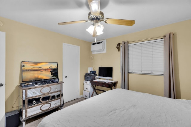 119 Cortez Dr Unit 8G, Islamorada, FL 33036 - bedroom with wood finished floors, ceiling fan, and a wall mounted AC