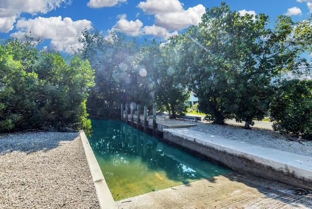 119 Cortez Dr Unit 8G, Islamorada, FL 33036 - view of swimming pool with a boat ramp