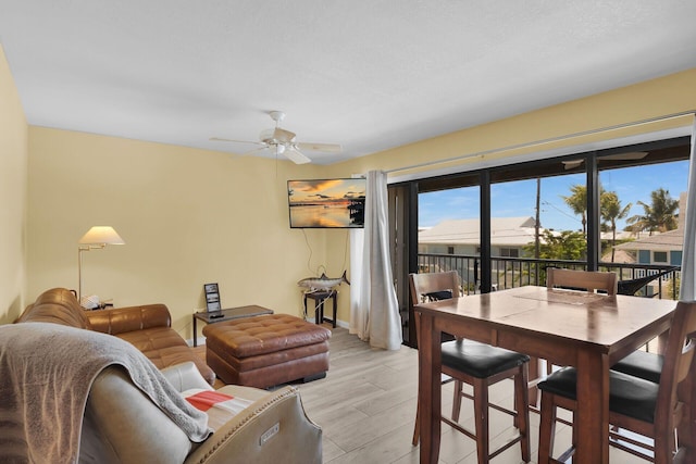 119 Cortez Dr Unit 8G, Islamorada, FL 33036 - living area with ceiling fan, light wood-style floors, and baseboards