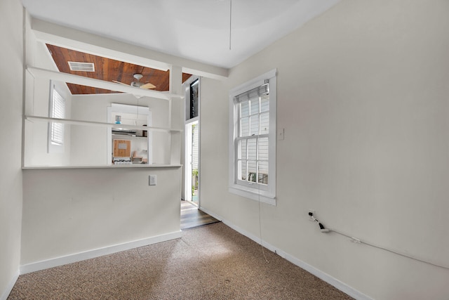 unfurnished dining area with plenty of natural light, baseboards, visible vents, and ceiling fan