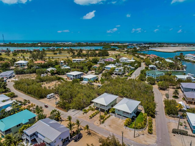 aerial view featuring a water view and a residential view