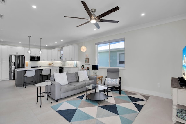 living room with visible vents, baseboards, a ceiling fan, and recessed lighting