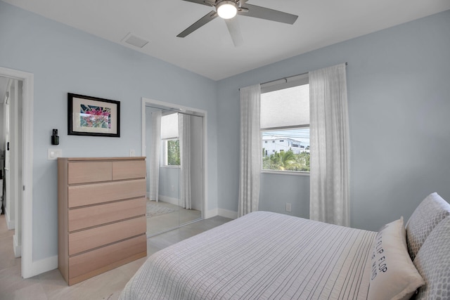 bedroom featuring visible vents, baseboards, and a ceiling fan