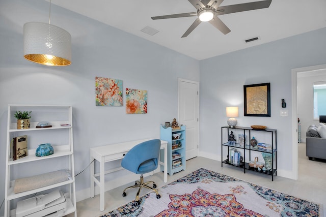 home office with a ceiling fan, baseboards, and visible vents