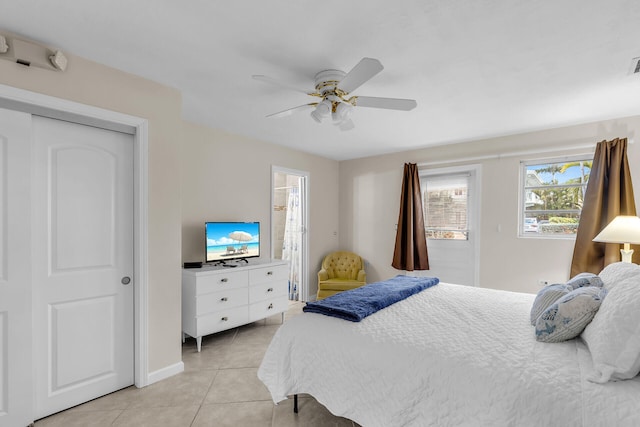 460470 11th St, Key Colony, FL 33051 - bedroom featuring light tile patterned floors, visible vents, and a ceiling fan