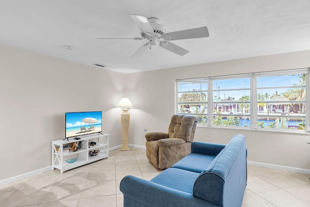 460470 11th St, Key Colony, FL 33051 - living area featuring visible vents, ceiling fan, baseboards, and light tile patterned floors