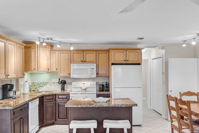460470 11th St, Key Colony, FL 33051 - kitchen featuring light tile patterned floors, white appliances, a sink, and tasteful backsplash