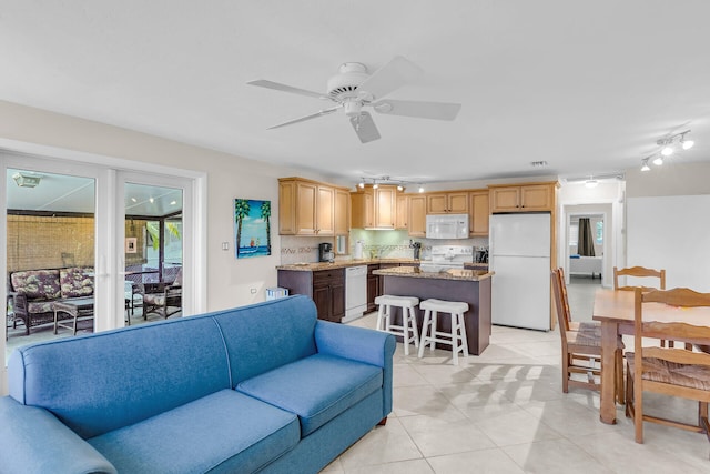 460470 11th St, Key Colony, FL 33051 - living room featuring light tile patterned flooring and ceiling fan