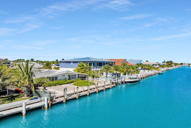 exterior space with a residential view and a water view