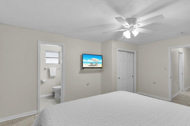460470 11th St, Key Colony, FL 33051 - bedroom featuring a closet, light tile patterned flooring, ensuite bath, and baseboards