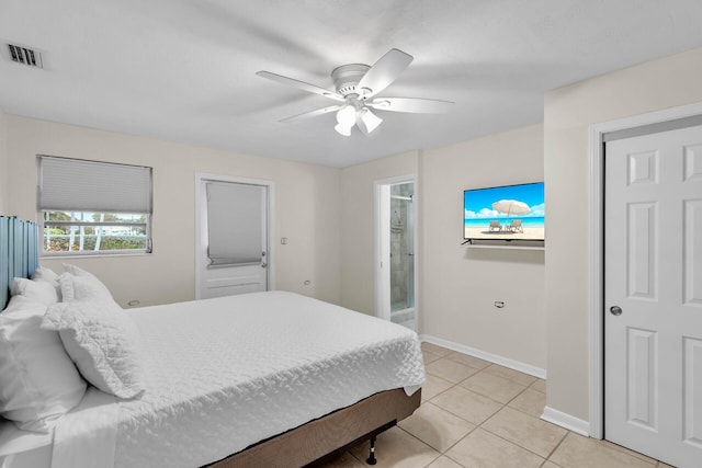 460470 11th St, Key Colony, FL 33051 - bedroom with light tile patterned floors, ceiling fan, ensuite bathroom, visible vents, and baseboards
