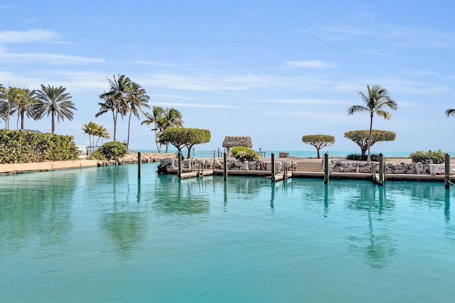 view of swimming pool featuring a dock and a water view