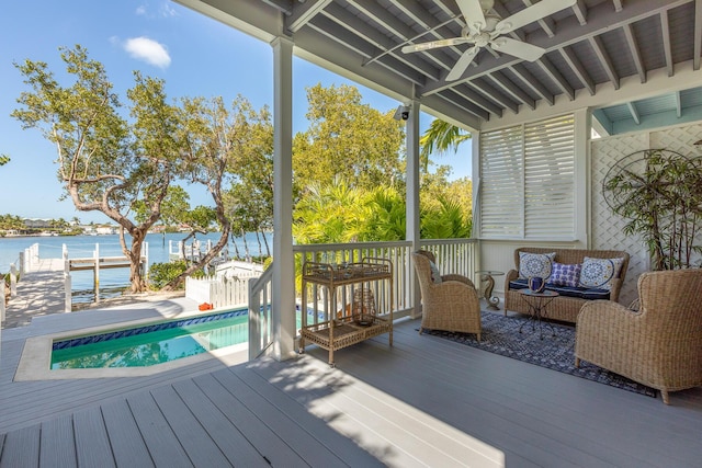 2605 Gulfview Dr, Key West, FL 33040 - wooden terrace with an outdoor pool, outdoor lounge area, a water view, and a ceiling fan