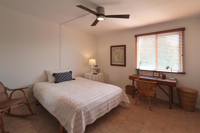 bedroom with tile patterned floors and ceiling fan