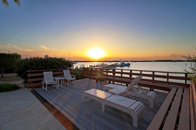 view of dock featuring a deck with water view