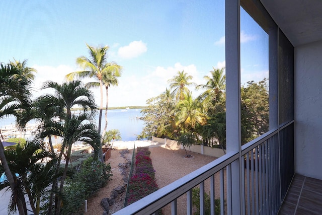 balcony featuring a water view