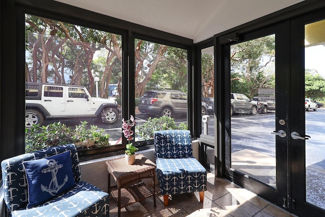 sunroom / solarium with french doors and lofted ceiling