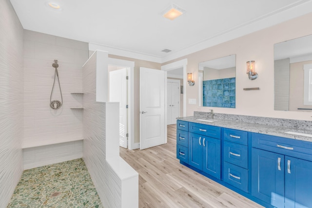 bathroom with hardwood / wood-style flooring and vanity