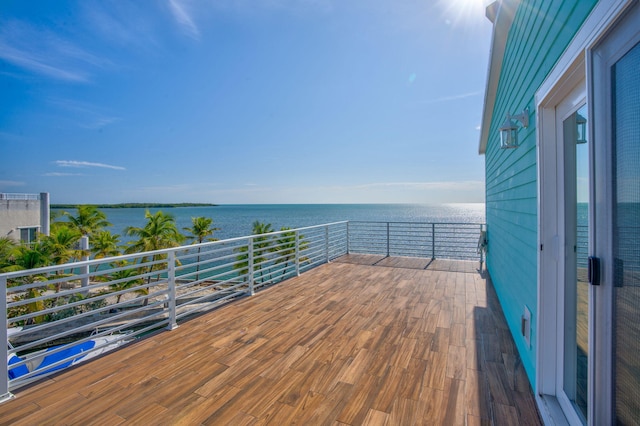 wooden terrace with a water view