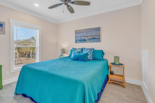 bedroom with ornamental molding and ceiling fan