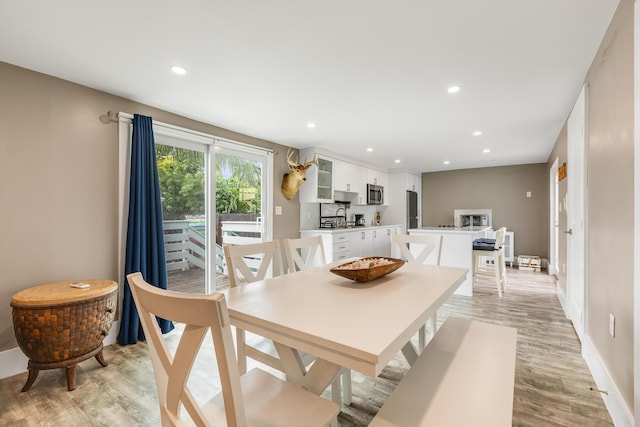 dining area with light wood-type flooring