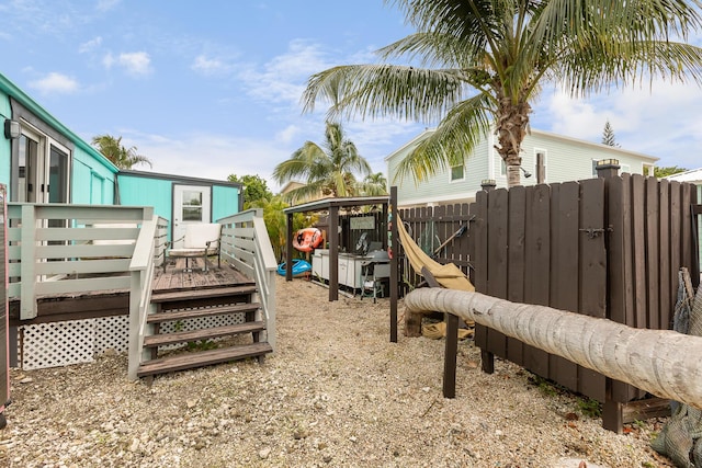 view of yard featuring a wooden deck