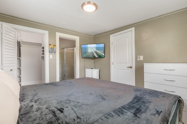 unfurnished bedroom featuring a spacious closet