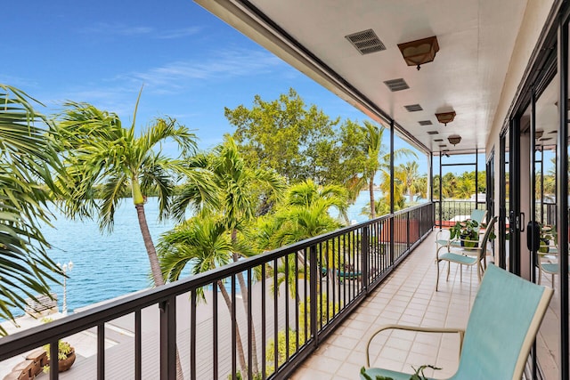 balcony featuring a water view