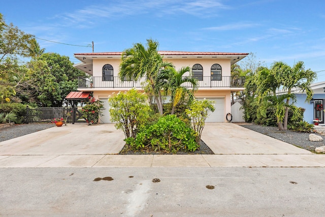 view of front of house with a garage and a balcony