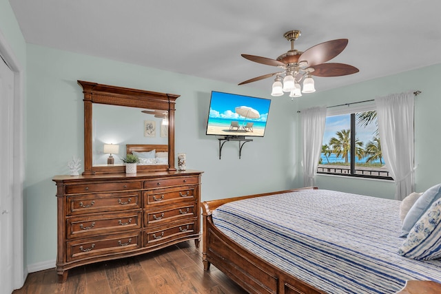 bedroom featuring dark wood-type flooring and ceiling fan