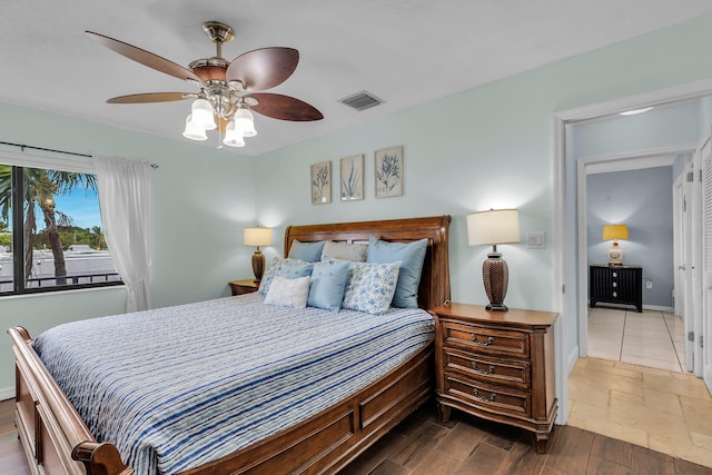 bedroom with hardwood / wood-style floors and ceiling fan