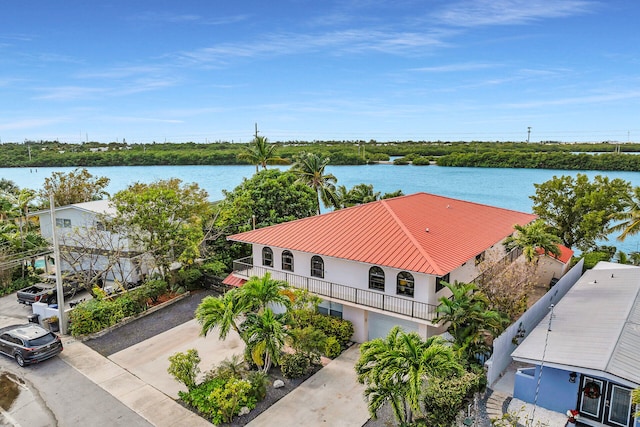 birds eye view of property with a water view