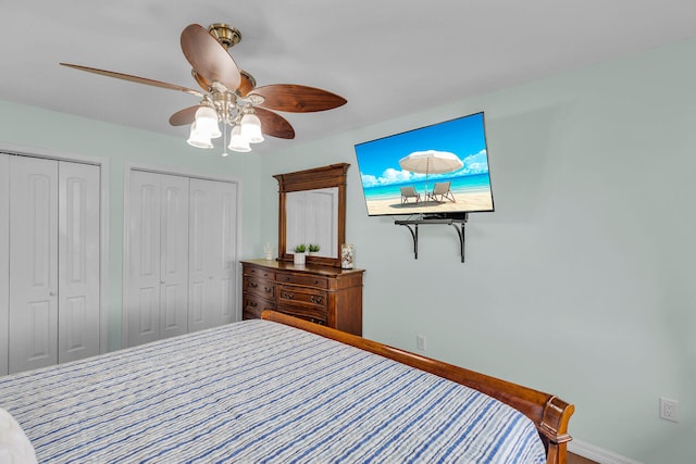 bedroom with multiple closets and ceiling fan