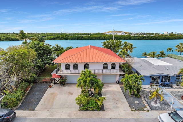 birds eye view of property with a water view