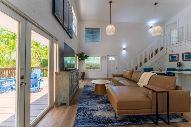 460 Barry Ave, Little Torch, FL 33042 - living area featuring stairway, light wood-style flooring, healthy amount of natural light, and a high ceiling
