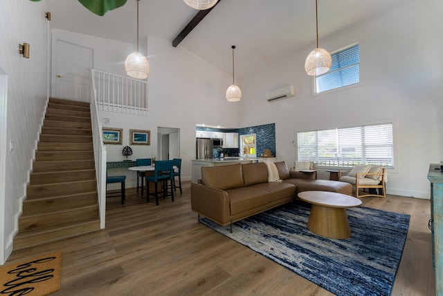 460 Barry Ave, Little Torch, FL 33042 - living area featuring wood finished floors, stairs, high vaulted ceiling, beam ceiling, and plenty of natural light