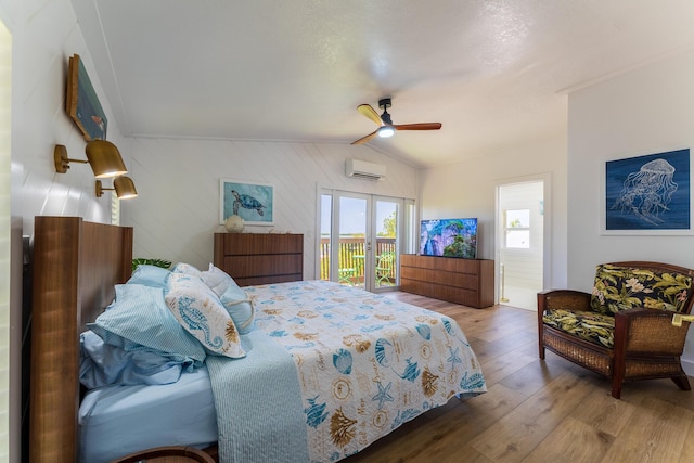 460 Barry Ave, Little Torch, FL 33042 - bedroom featuring lofted ceiling, wood finished floors, access to outside, french doors, and a wall unit AC