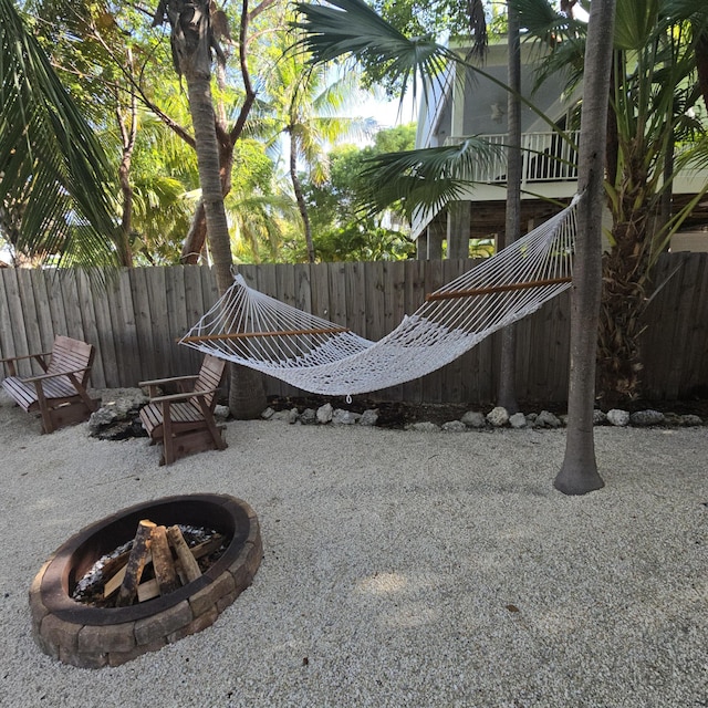 460 Barry Ave, Little Torch, FL 33042 - fenced backyard featuring a fire pit