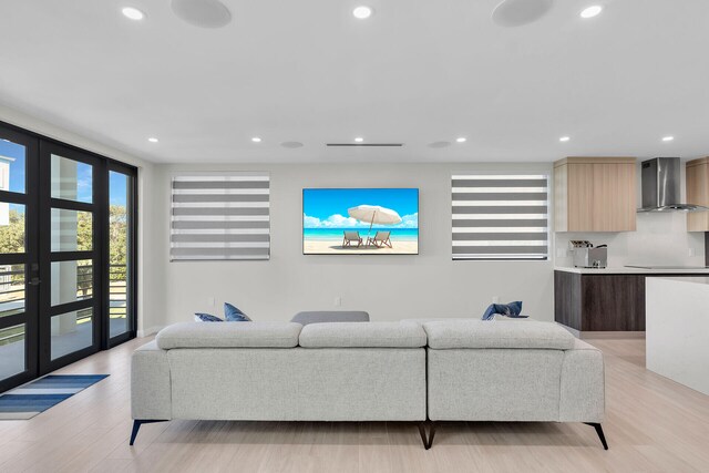 living room with french doors and light hardwood / wood-style floors