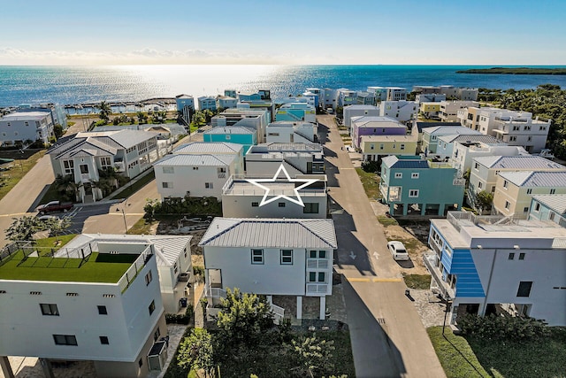 bird's eye view featuring a water view and a residential view
