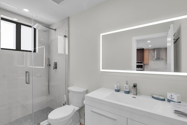 full bath with vanity, toilet, recessed lighting, a shower stall, and visible vents
