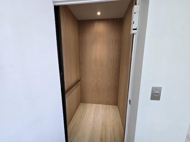 room details featuring recessed lighting and elevator